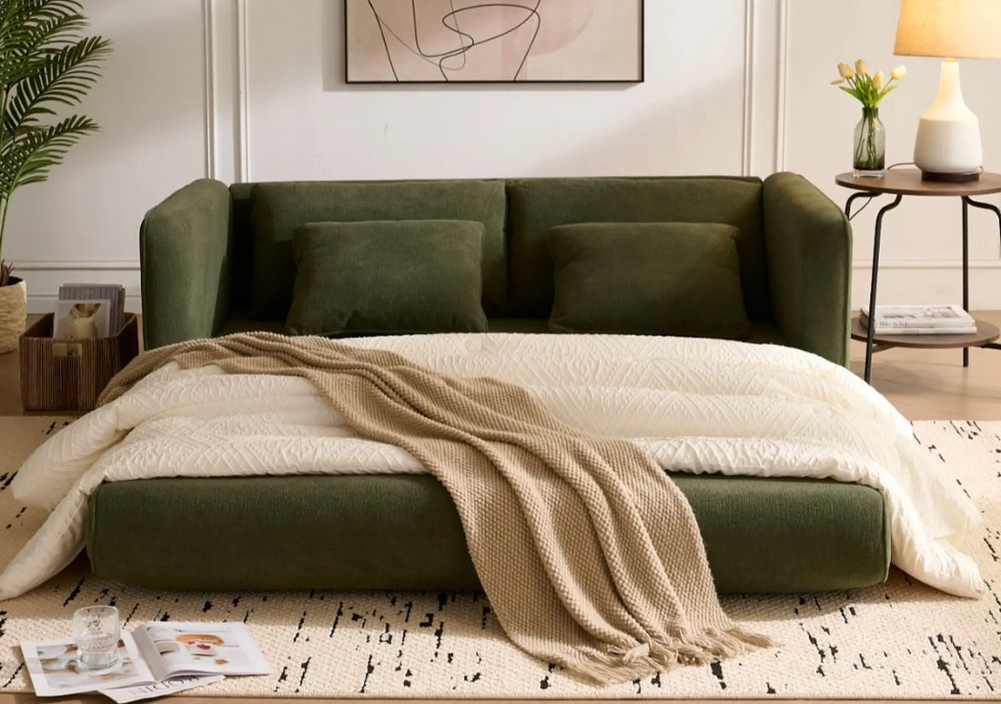 Space-saving green sofa with integrated bed frame and cream bedding in bright bedroom